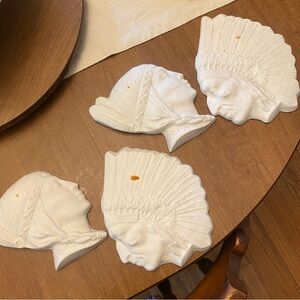 Antique chalk ware maiden and chief wall hangers unpainted